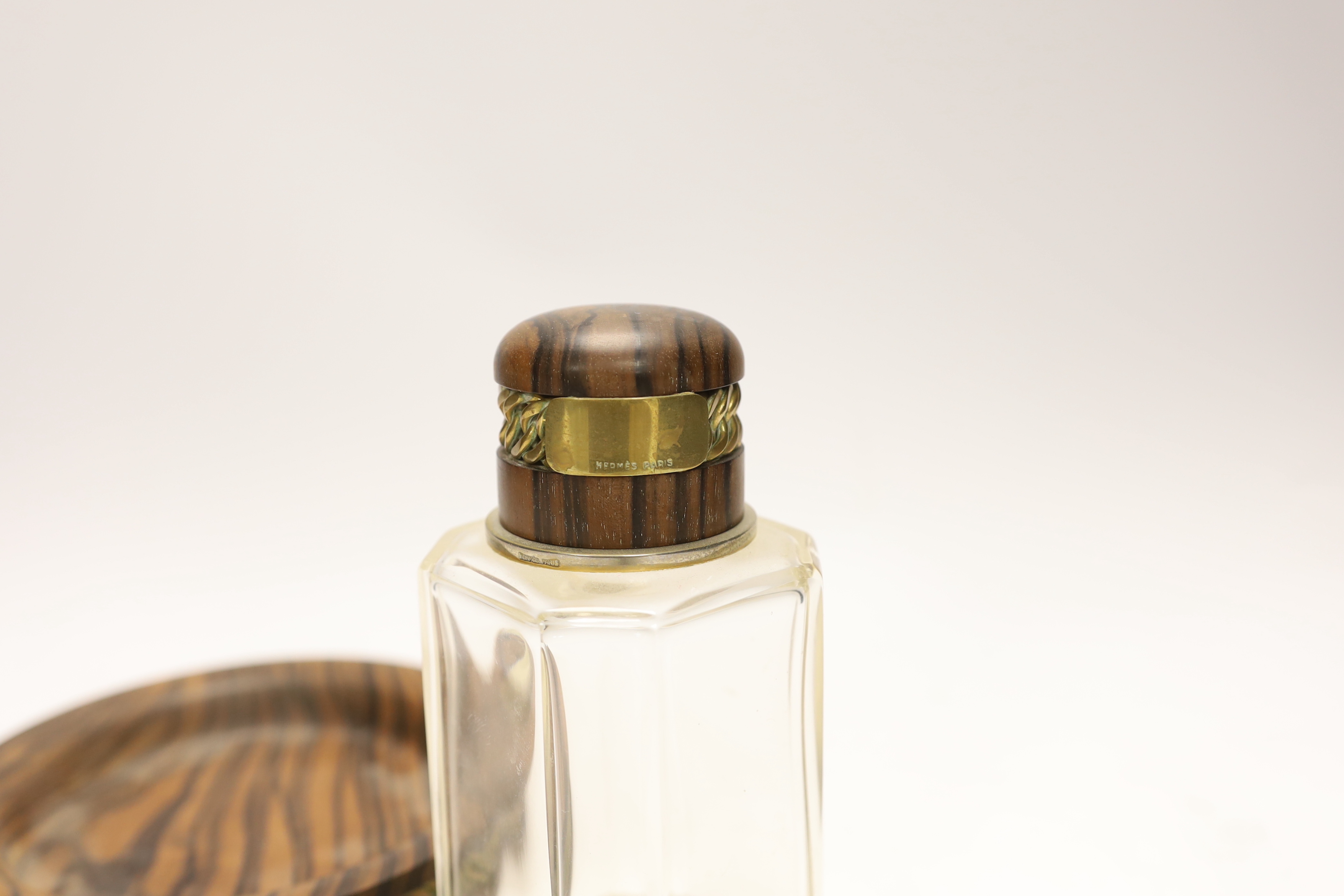 A Hermes scent bottle, 15cm high, and a zebra wood coaster